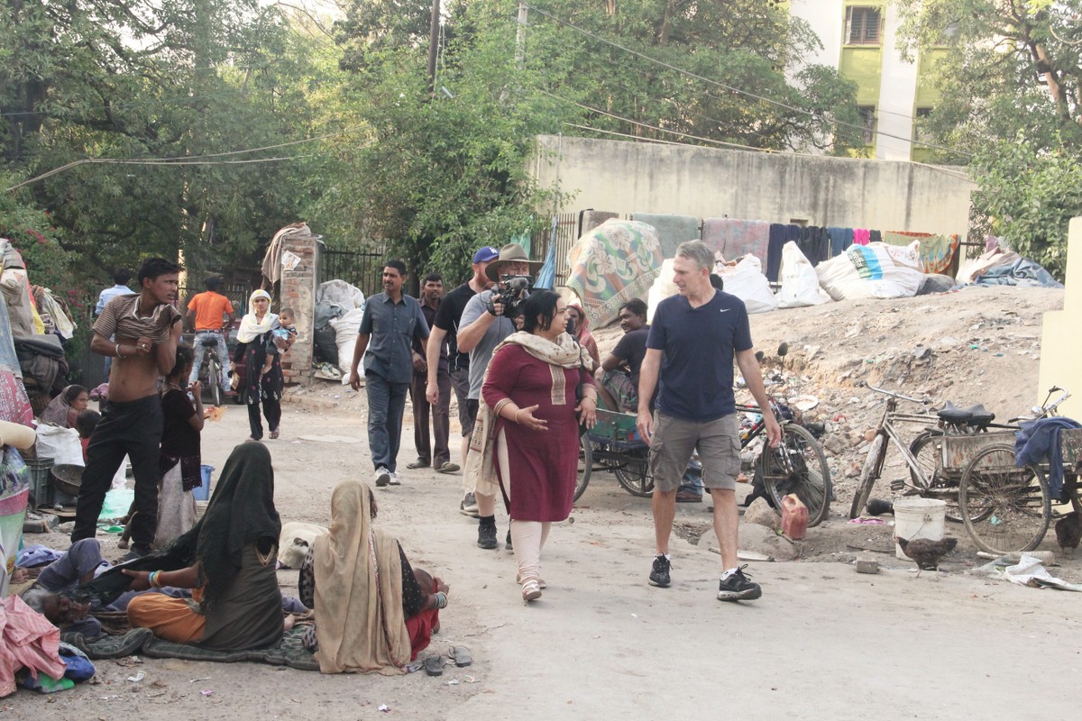Damien entering Kanak Durga slum colony with Asha’s Sr. Programme Coordinator, Ayesha