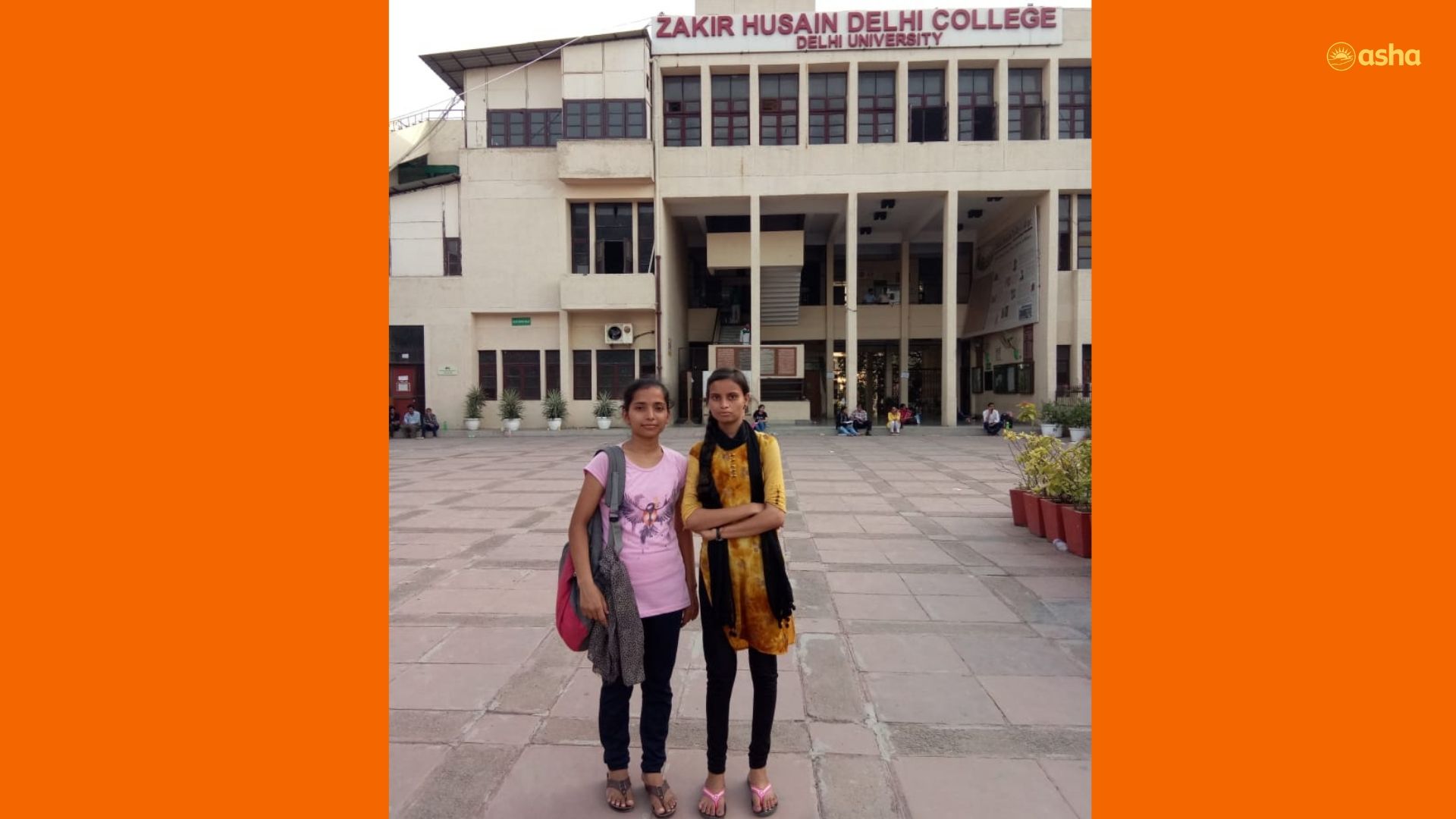 Archana (R) in front of her college
