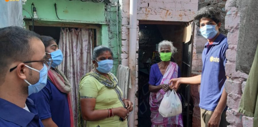 Asha warriors hand out essential groceries to the slum residents