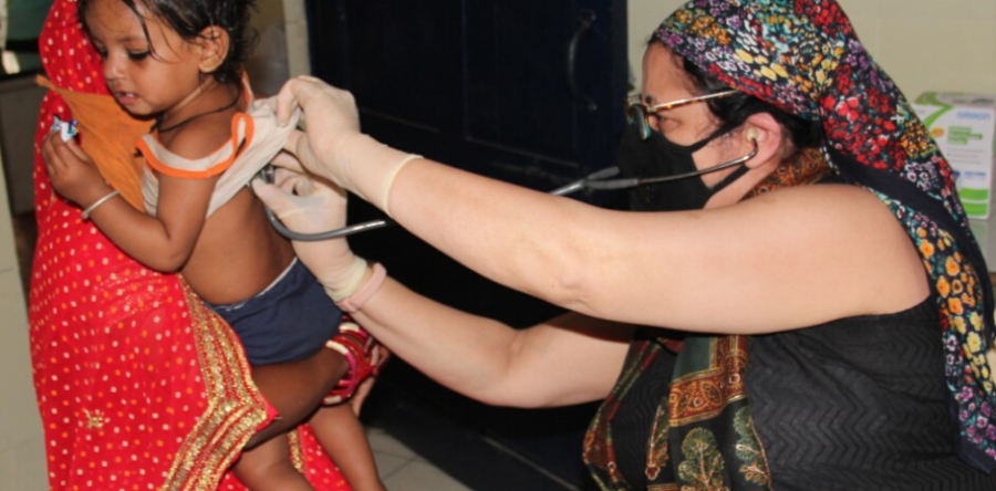 Dr Kiran visits families in Mayapuri slum community