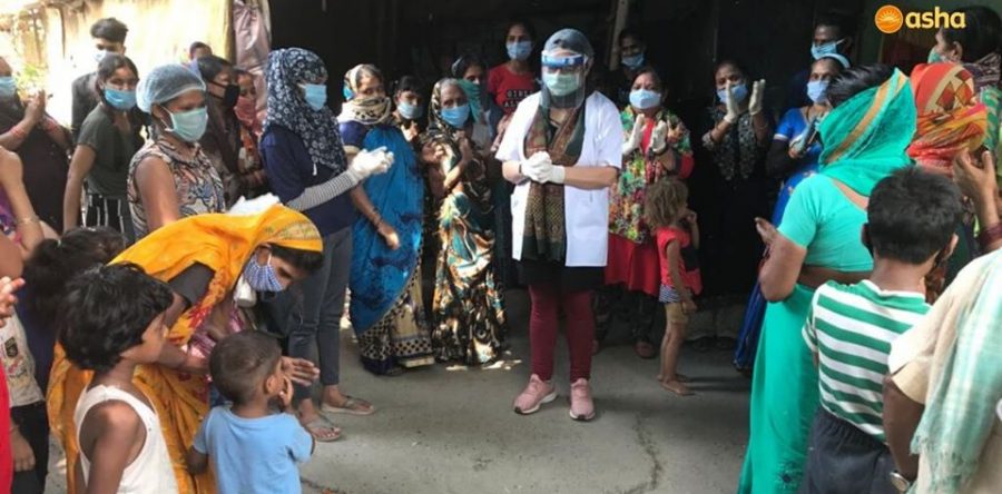 Dr Kiran celebrates her birthday with the Asha family in Safedi Basti slum colony